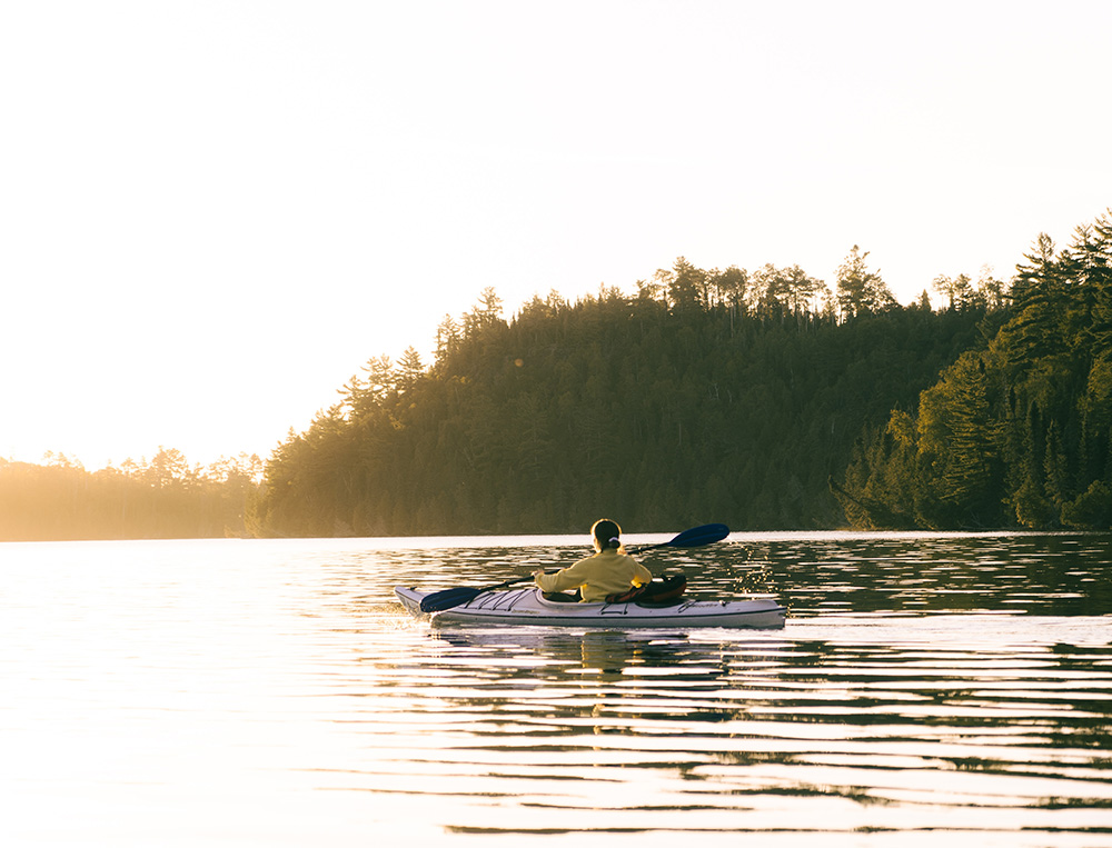 woman paddling in kayak