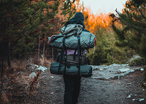 man wearing backpacking pack