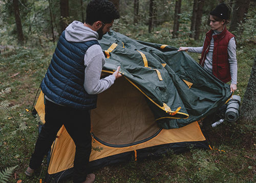 People setting up a tent